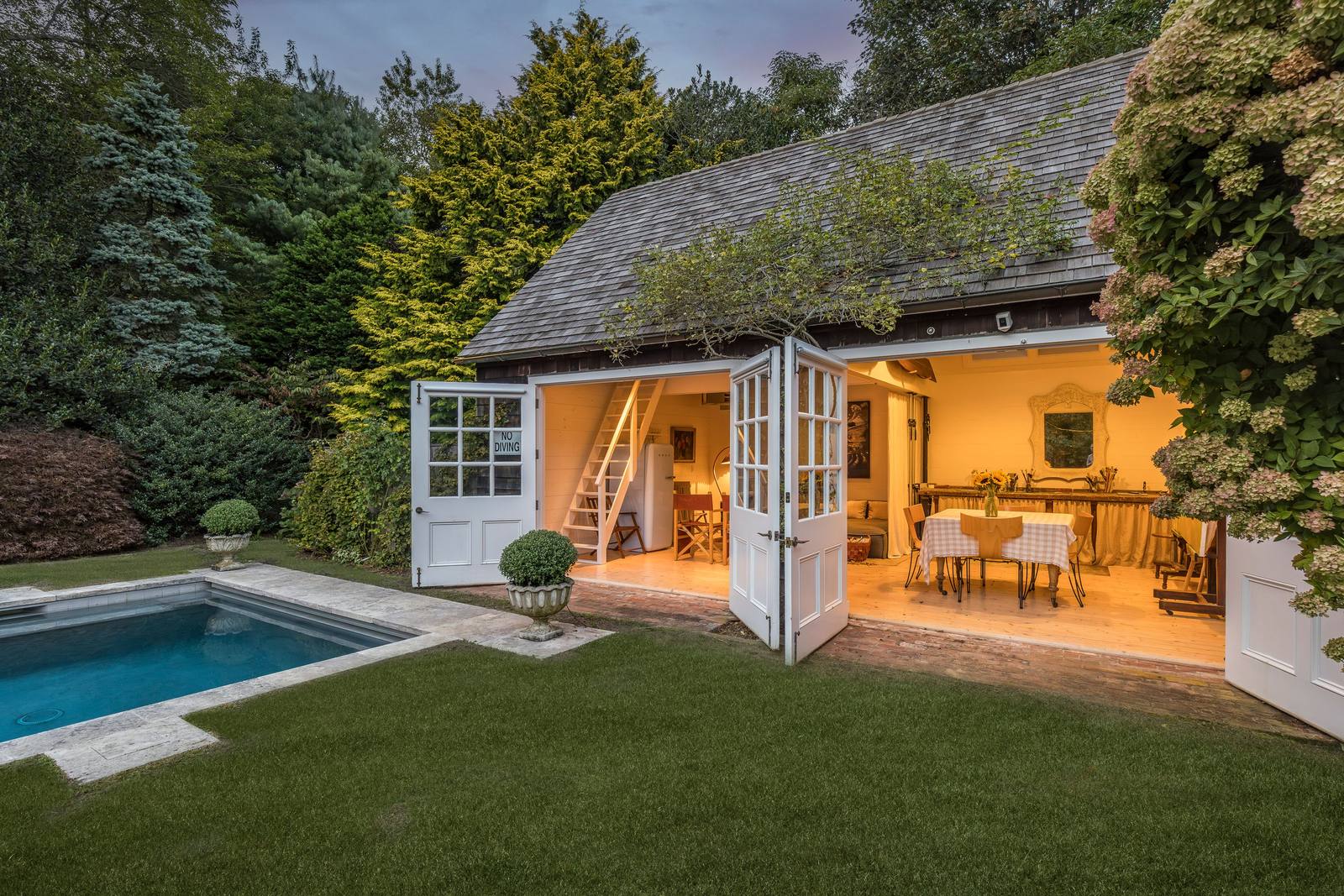Open garden doors beside the pool