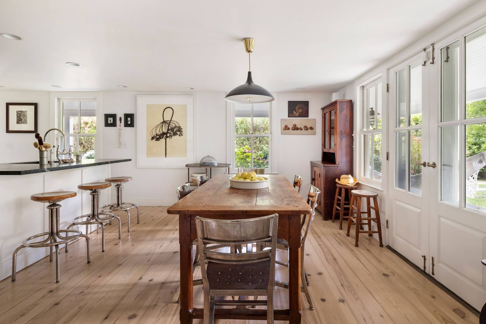 The bright kitchen and long wooden table