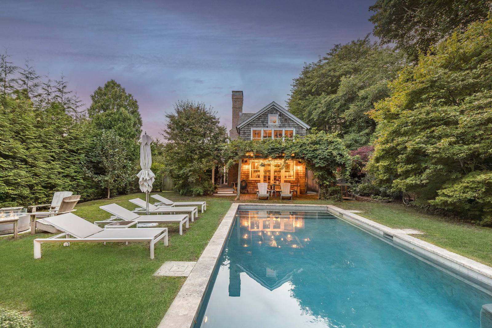 The pool and back of the house at dusk